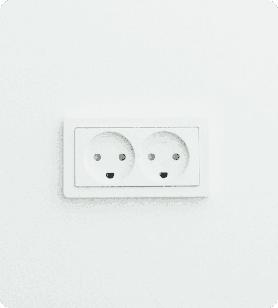 Electrical outlet on white wall